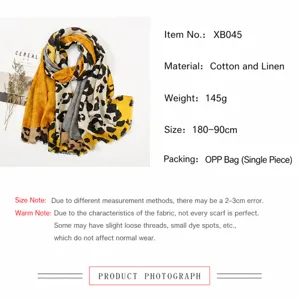 Detail of leopard print cotton linen scarf showing 180x90cm dimensions and 145g weight