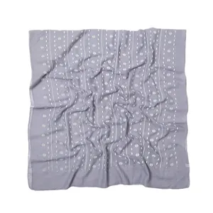 Blue cotton linen scarf with white dots and geometric patterns on white background