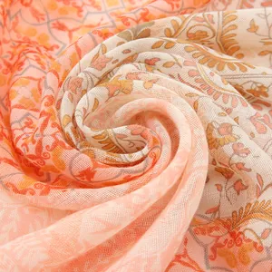 Bohemian paisley print scarf in orange and ginger yellow with gold thread texture