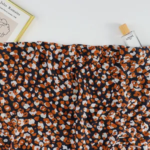 Ethnic orange leopard print scarf with bohemian pattern and lightweight texture