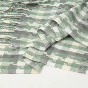 Winter checkered scarf with green and grey mosaic pattern and tassel fringe detail