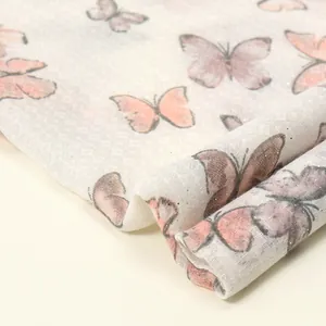 Sciarpa di cotone e lino rosa con stampa farfalla e decorazione in polvere glitter