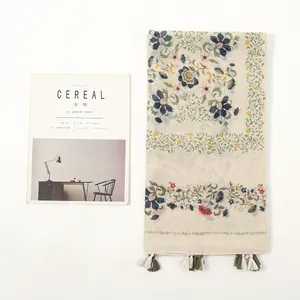 Floral cotton linen beach shawl with tassels and vintage vine print on white background