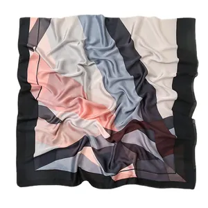 Elegant geometric patterned satin scarf with pink, grey and blue blocks and black border