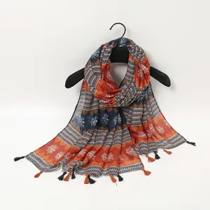 Bohemian geometric printed scarf with colorful tassels and soft linen texture