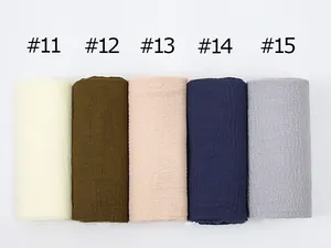Close-up of five pleated cotton linen scarves in various solid colors with numbered labels