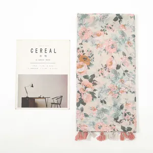 Linen feel floral scarf with tassels and pastel flower patterns for sun protection