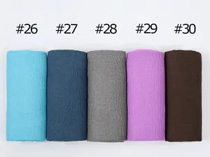 Detail view of cotton linen scarves showing pleated textures in colors #26 to #30