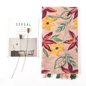 Floral print cotton linen scarf with tassels and large botanical patterns for beach wear