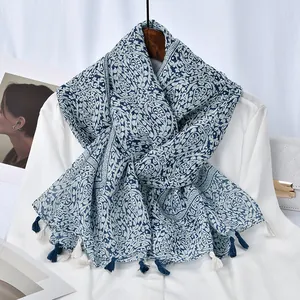 Blue paisley cotton linen scarf with ethnic patterns and fringe detail on a white shirt