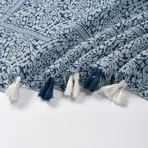 Blue paisley floral cotton linen scarf with handmade bicolor tassels on white background