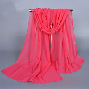 Detail of sheer chiffon scarf in fuchsia pink with neat overlock edge stitching