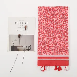 Floral print summer scarf with tassels for beach travel, minimalist flat lay design