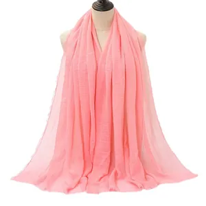 Pink crinkle cotton linen hijab shawl for women with soft fringe edges and drape