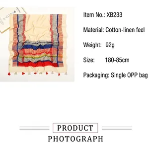 Detail of cotton-linen scarf with geometric stripes, fringe trim, and 180x85cm dimensions
