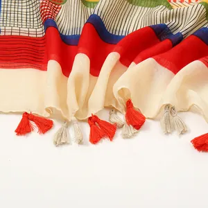 Colorful geometric striped sunscreen shawl with red and blue patterns and fringe trim