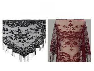 Detail of floral lace shawl featuring long tassels and mesh patterns in black and burgundy