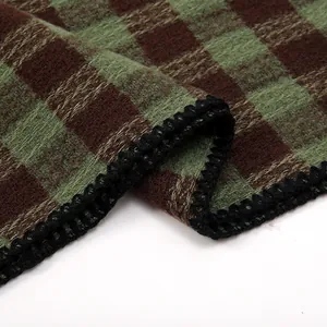 Thick checkered scarf in green and brown with elegant black lace edges for autumn