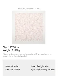 Detail of white cotton-linen floral scarf with tassel edges and size specifications