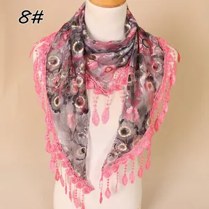 Close-up of lace edges and floral mesh fabric on a vintage triangular headscarf