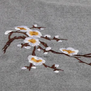 Elegant grey faux cashmere scarf with detailed plum blossom embroidery and tassel edges