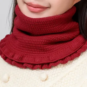 Red knit neck warmer with honeycomb texture and decorative ruffled hem for winter