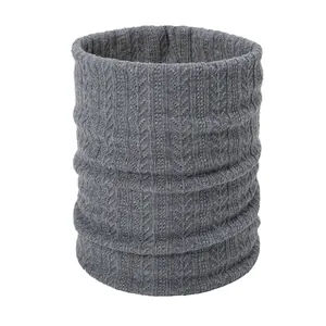 Detailed view of gray cable knit texture on a thick warm winter infinity snood scarf