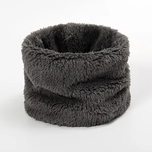 Detailed close-up of soft thick dark grey wool-like winter neck warmer with plush texture