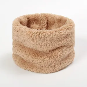 Close-up of thick light brown faux fur neck warmer showing fluffy winter texture