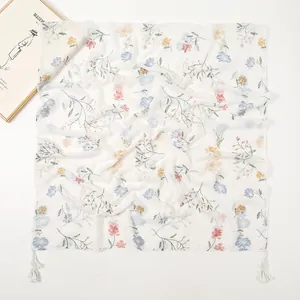Elegant white floral print scarf with soft tassels and delicate flower patterns