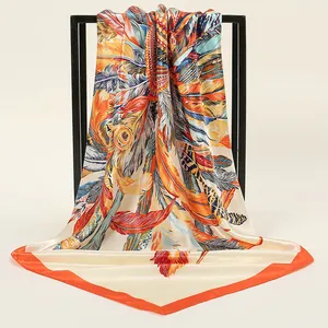 Elegant 90cm square silk scarf featuring colorful feather prints and orange borders
