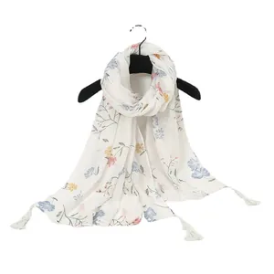 Elegant white cotton linen feel scarf with floral print and handmade fringe tassels