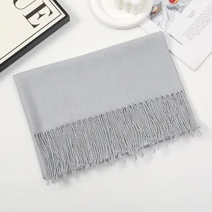 Minimalist light gray cashmere-feel scarf with tassels and fine woven texture
