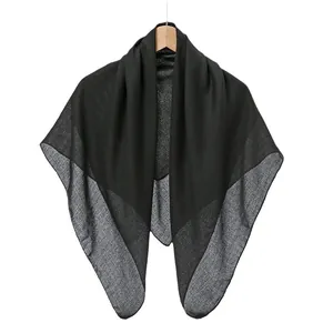 Classic solid black cotton linen square scarf displayed on a wooden hanger for women
