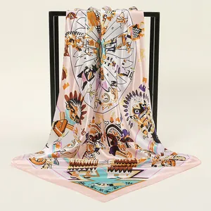 Close-up of a large silk square scarf with colorful tribal prints on a metal stand