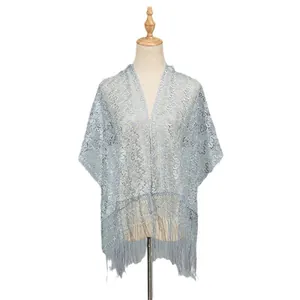 Light blue lace shawl featuring delicate hollow-out patterns and stylish fringe tassels