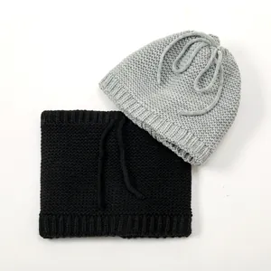 Detail view of thick knit winter neck warmer and beanie with soft thermal texture