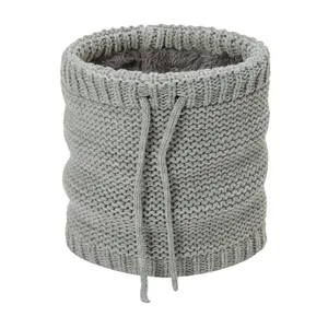 Close-up of gray knitted neck warmer with thick fleece lining and adjustable drawstring