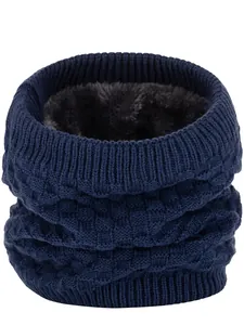 Detailed view of winter neck gaiter featuring navy waffle knit and thick gray faux fur lining