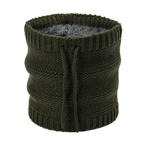 Detailed texture of dark olive green knit scarf with thick warm fleece lining and drawstrings