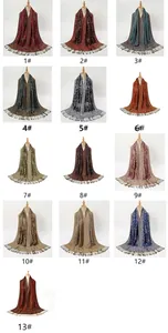 Detailed grid showing 13 colors of paisley patterned scarves with fringe and embroidery