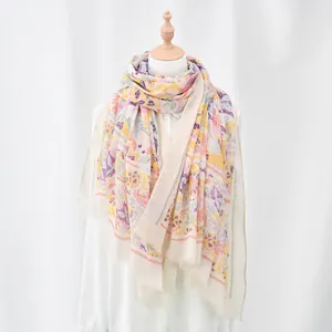 Detail of floral print on lightweight ethnic style scarf with fine frayed edges
