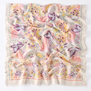 Detail of lightweight printed floral scarf showing soft texture and natural fringe edges