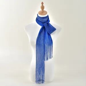Detail of royal blue sparkly scarf featuring fine metallic knit and elegant long fringes