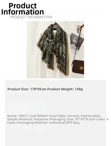 Detail of dark green scarf with white leaf patterns and product size 178x85cm