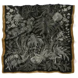 Linen feel scarf with white leaf patterns and golden borders on black background