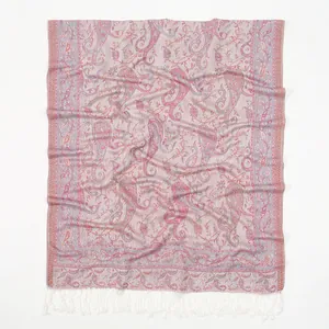Detail view of pink paisley pattern polyester scarf with delicate white fringe edge