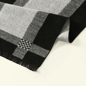 Classic black and grey plaid cashmere scarf with tassel edges and thick weave texture