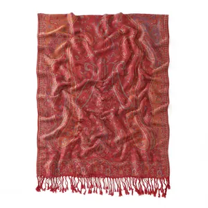 Detailed view of red Paisley jacquard scarf showing intricate fabric texture and fringes