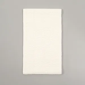 Detail of white thick knit texture on a polyester winter neck warmer scarf